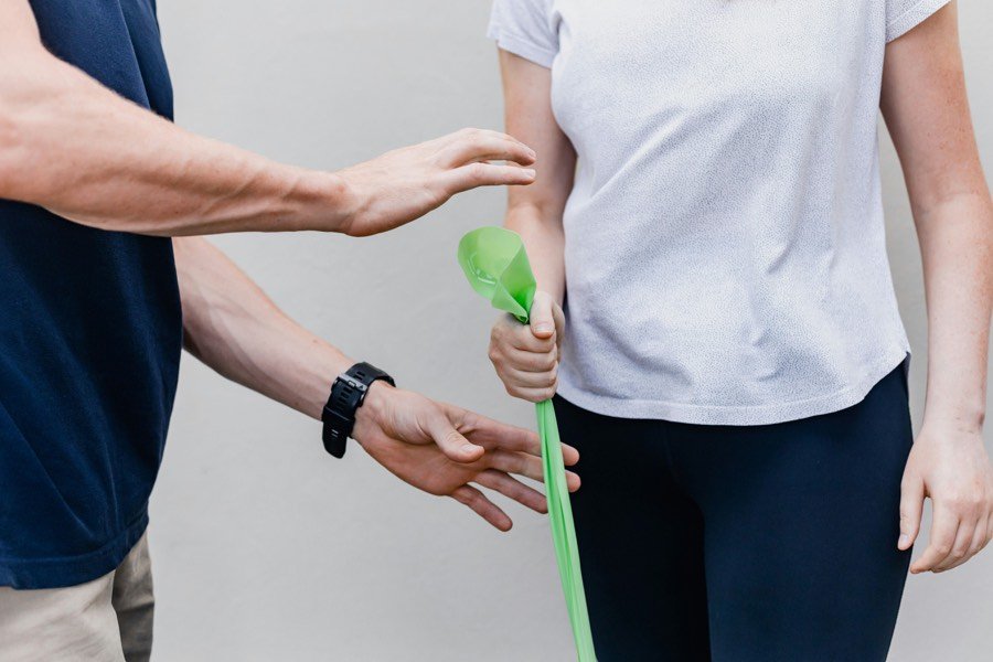 Patient training with a resistance band during rehabilitation